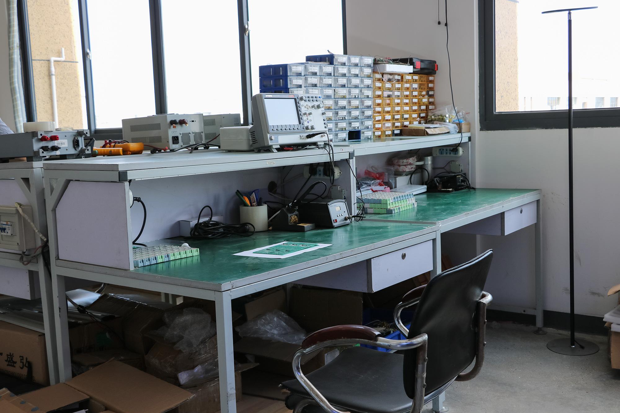 Lighting research and development workbench with electronic test equipment